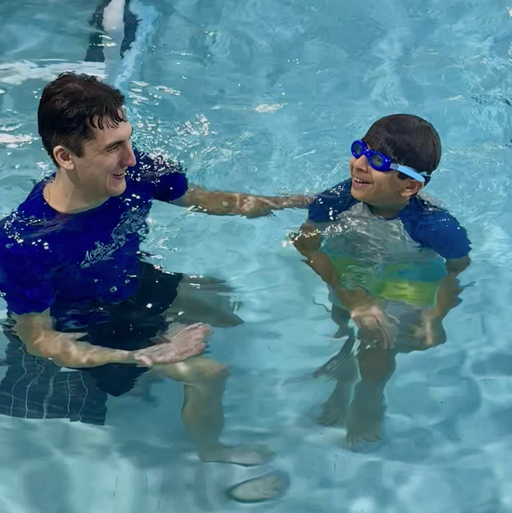 An instructor giving a student a private lesson.